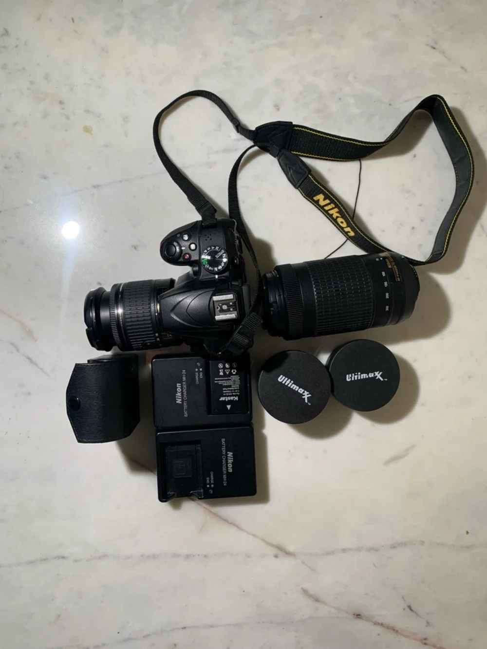 Nikon Black DSLR Camera with Two Zoom Lenses and Accessories
